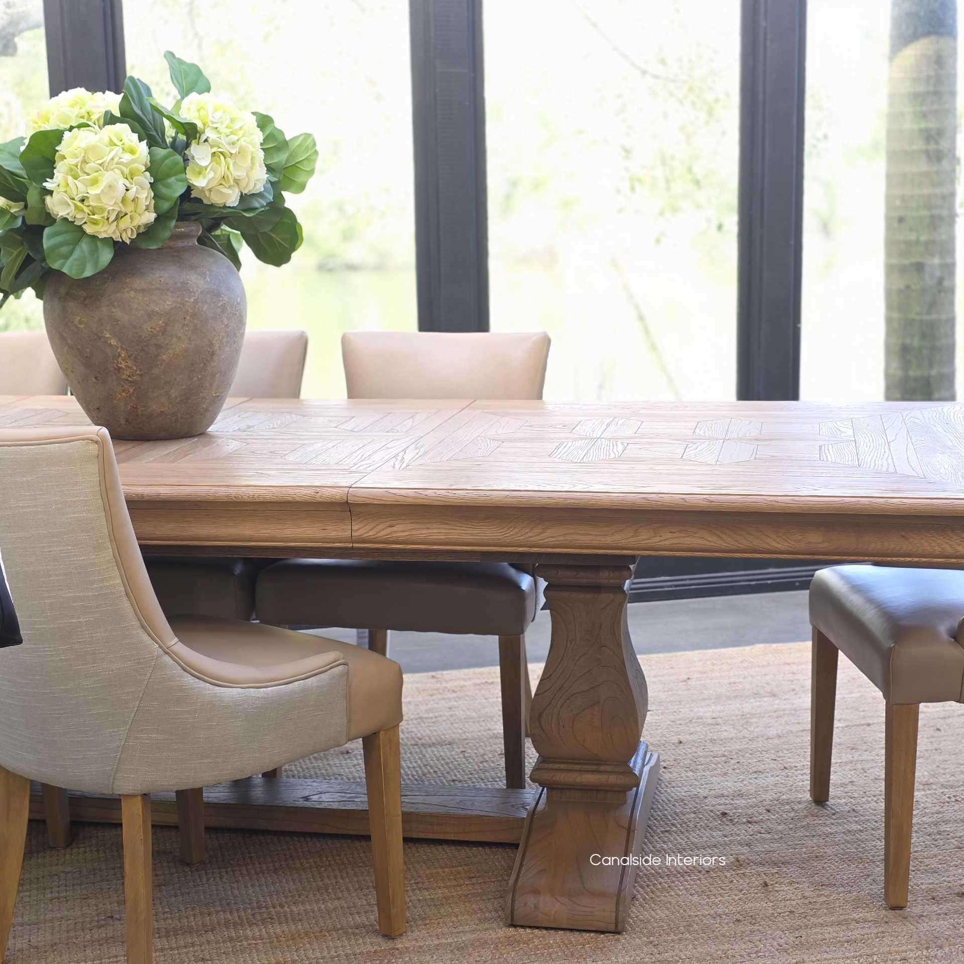Chesterton parquetry oak dining table styled in a timeless setting