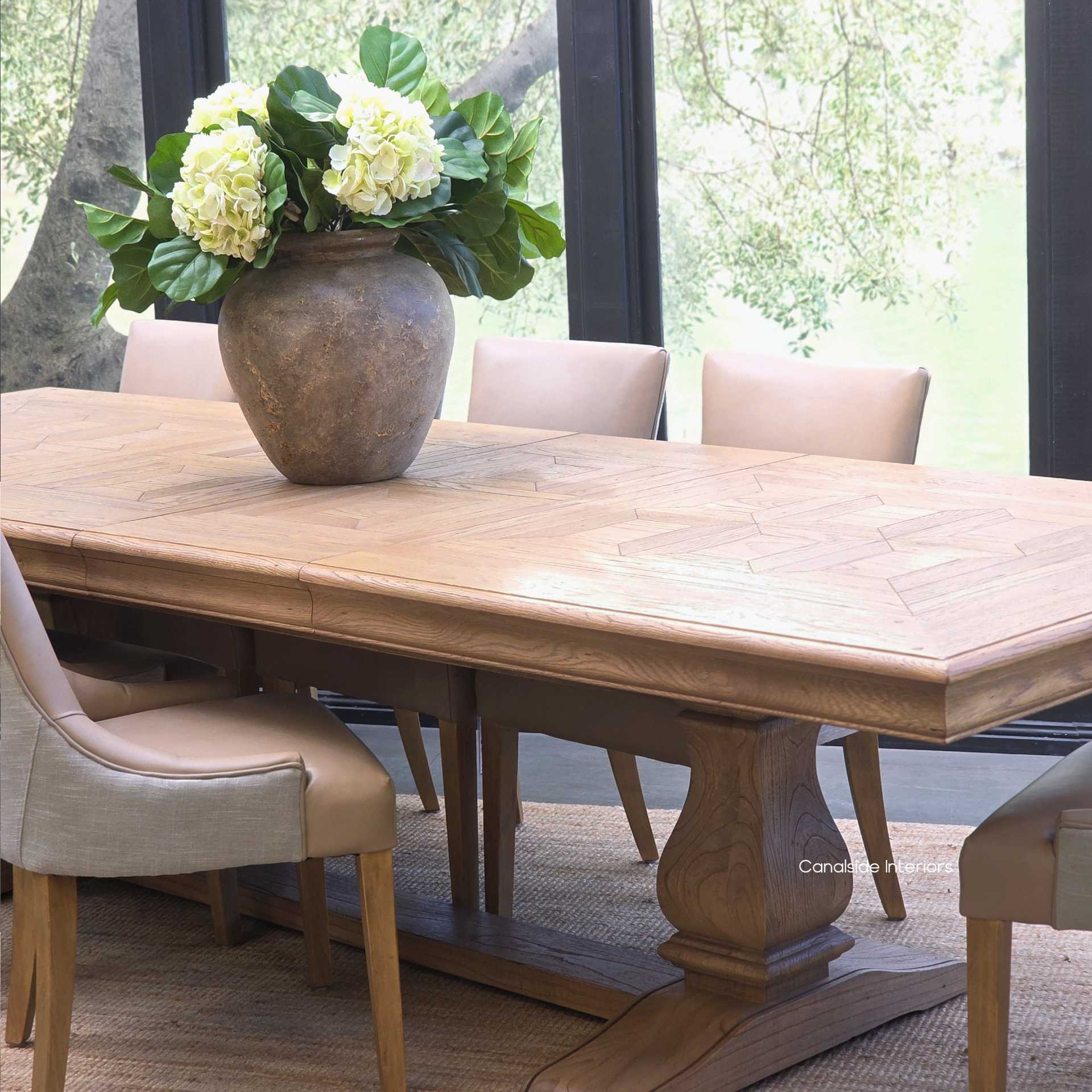 Wide view of the Chesterton oak parquetry table styled in a modern setting