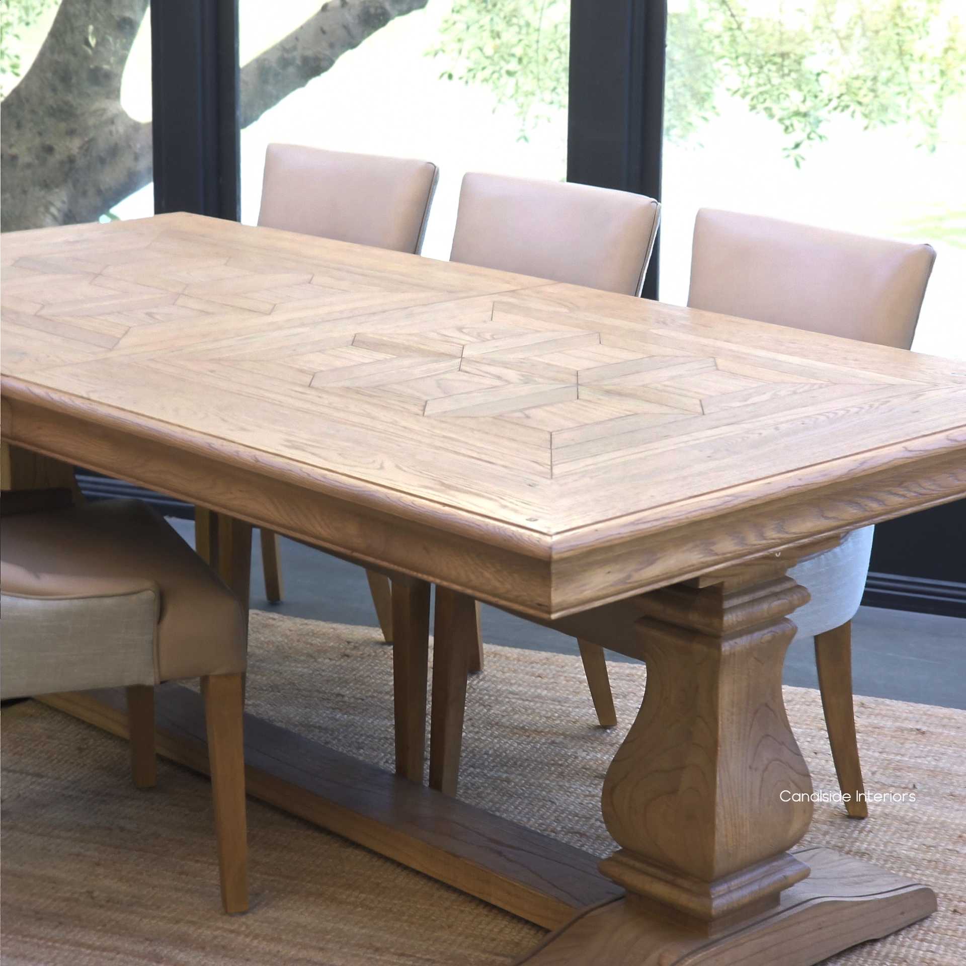 Chesterton oak parquetry table with both extensions folded neatly inside.