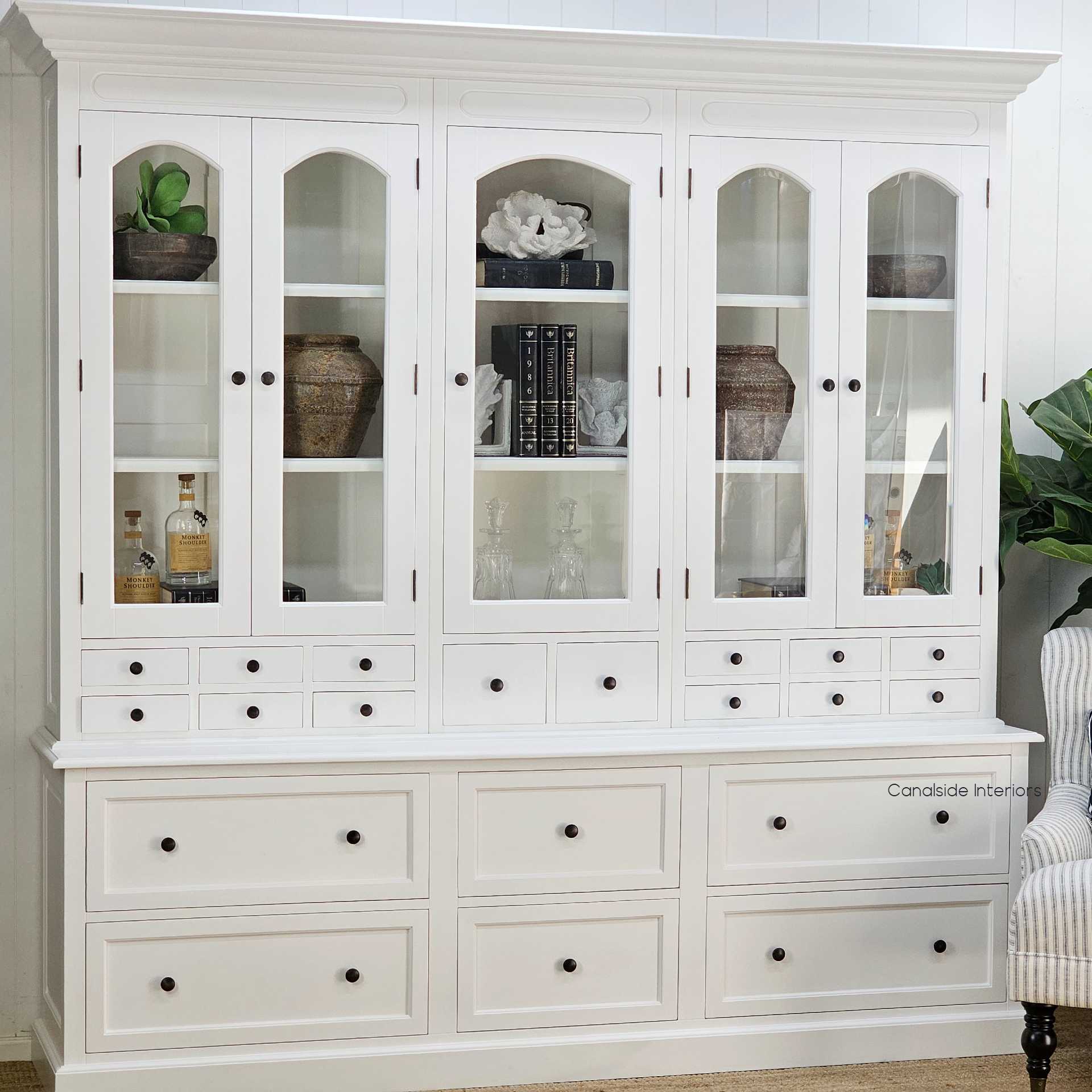Three-quarter angled view from the left side highlighting the profile of the crown moulding and drawer configuration.