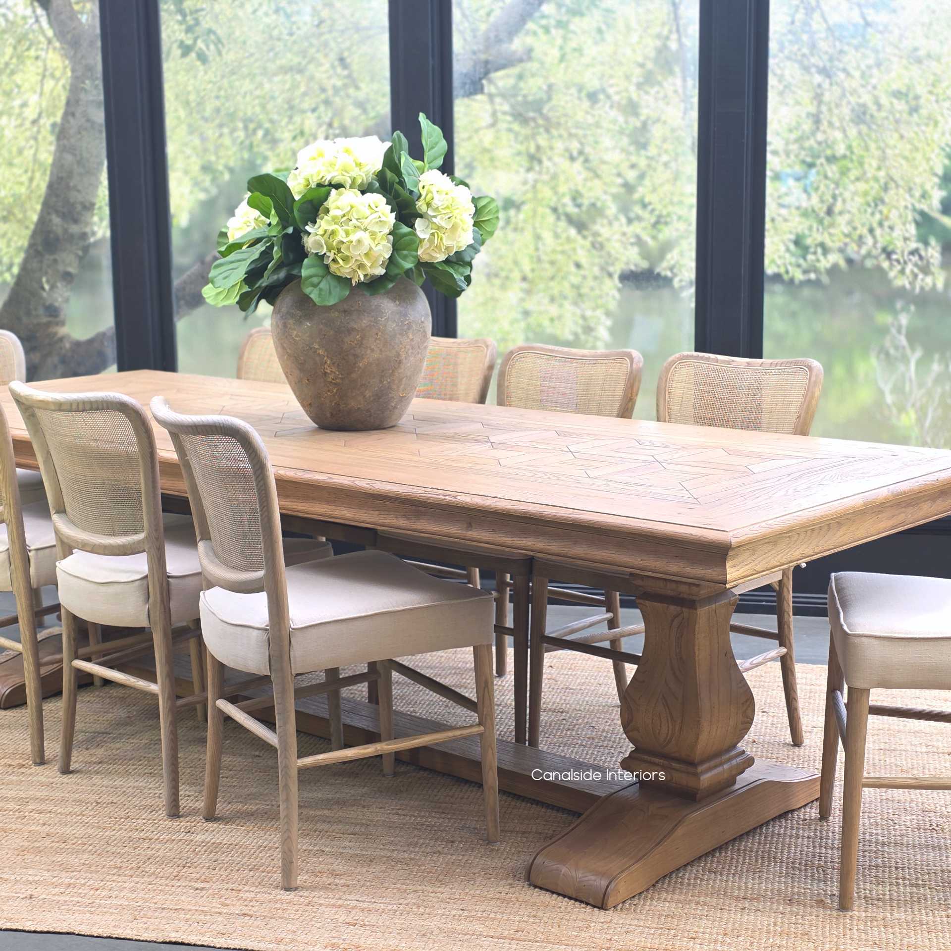 Wide shot of the Chesterton dining table placed in a Hamptons-style interior.