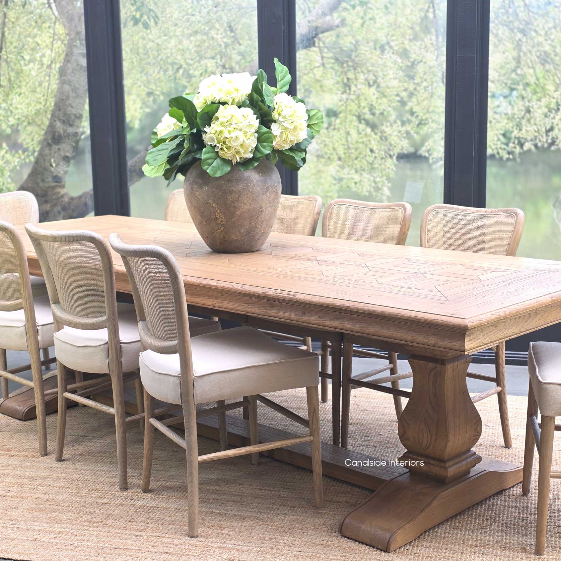 Side angle of the 280cm Chesterton table showing the warm oak finish and refined craftsmanship.