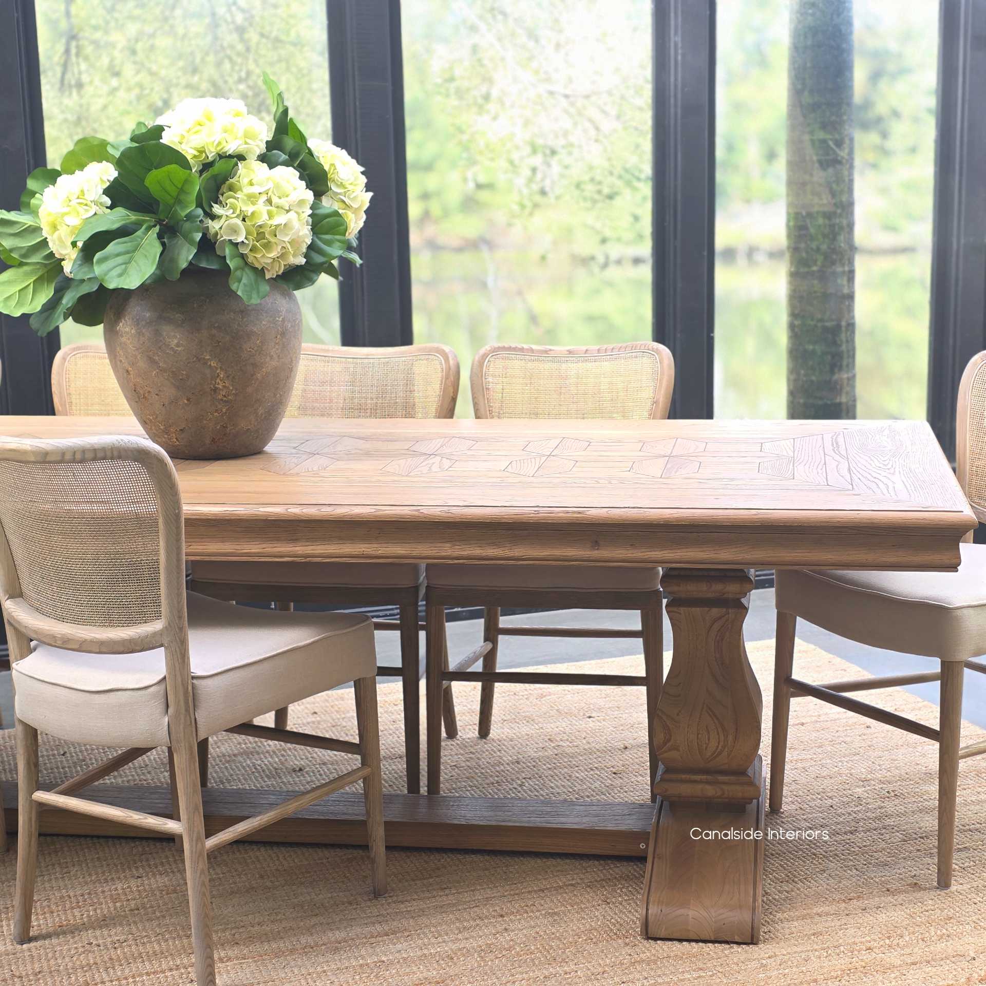 Lifestyle image with the Chesterton table styled with dining chairs 