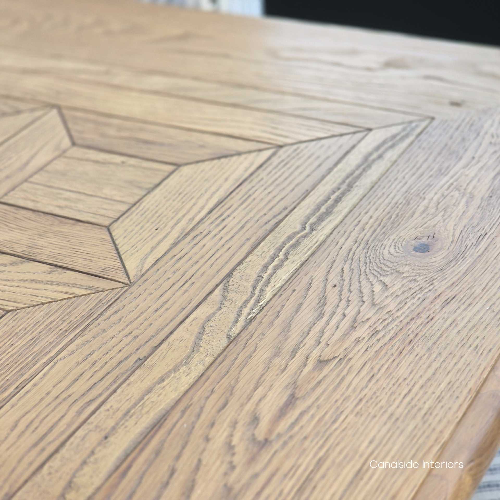 Close-up showing the subtle sheen of the hand-applied finish on the oak timber.