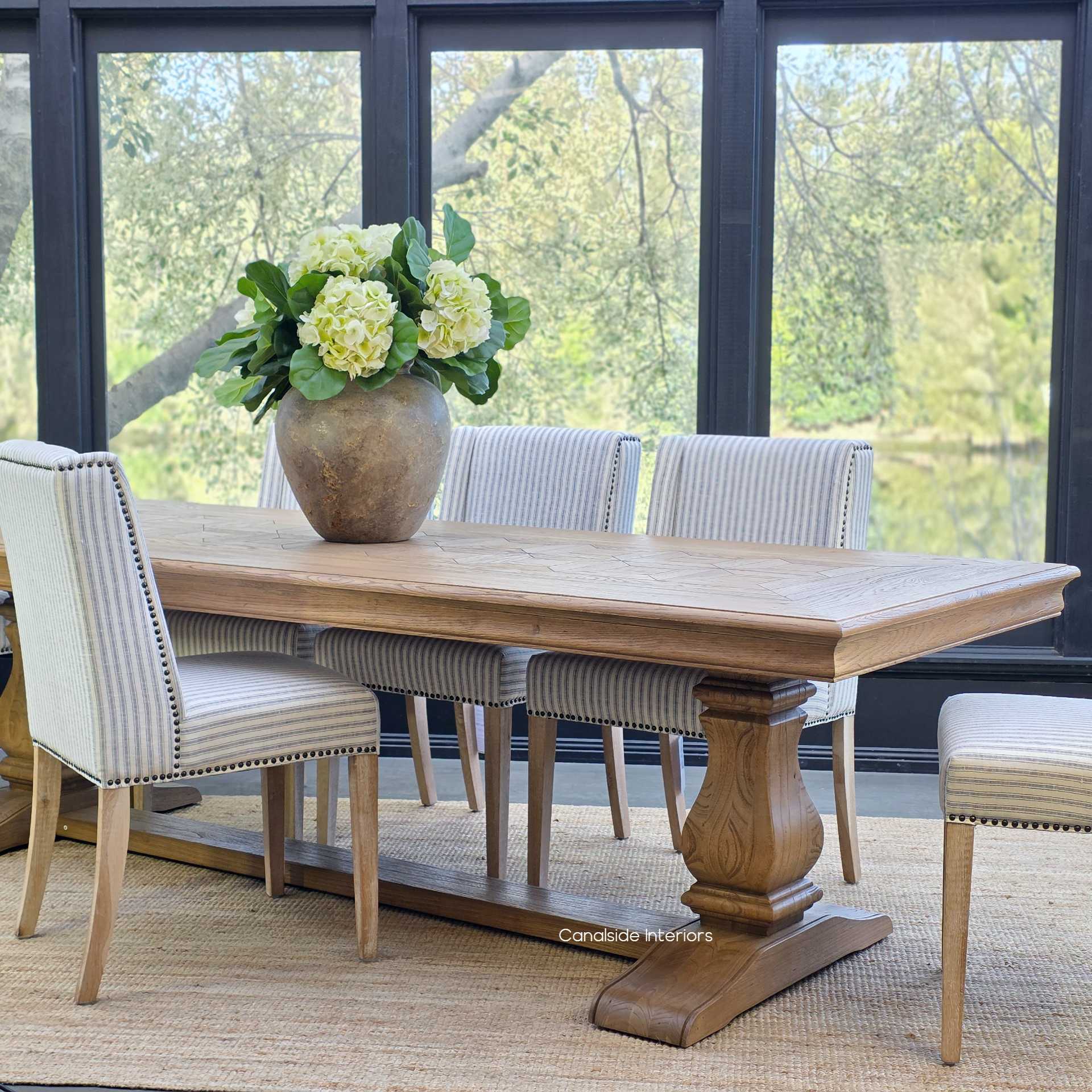 Styled dining room featuring the Chesterton Oak Table 280cm set for a family gathering.