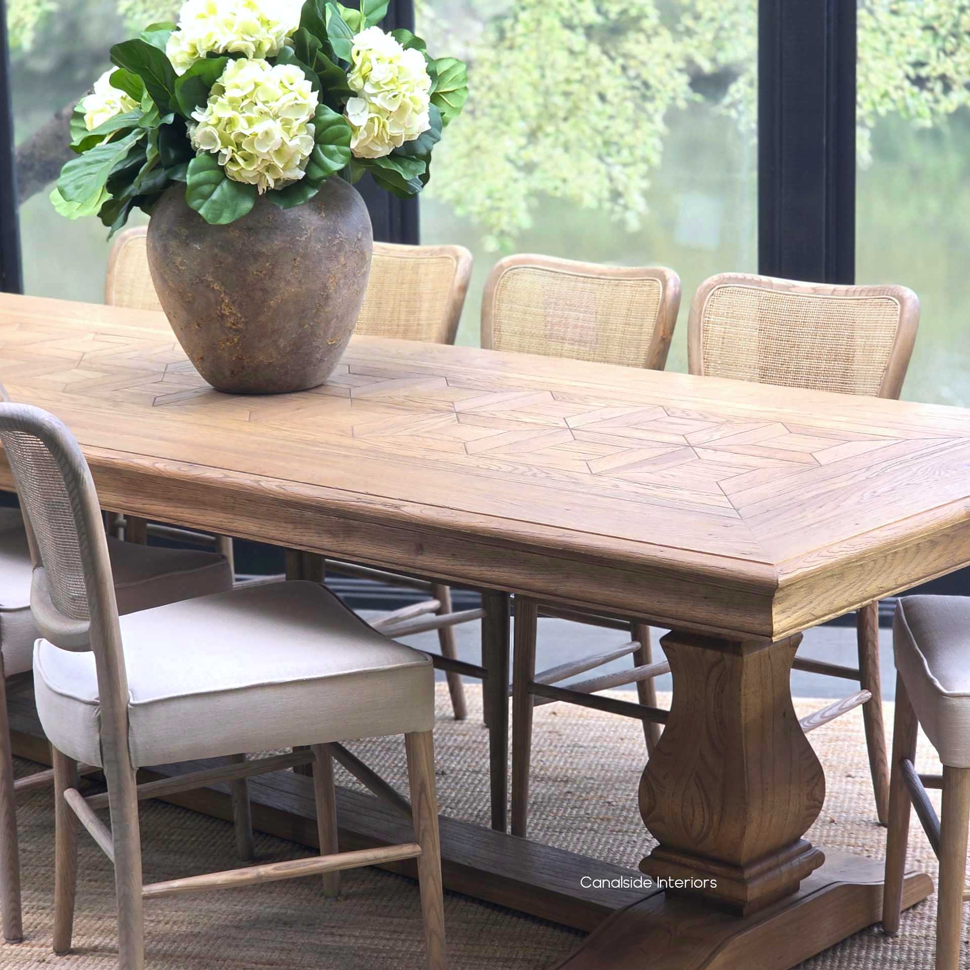 Chesterton oak parquetry dining table in a modern Hamptons-inspired dining room.