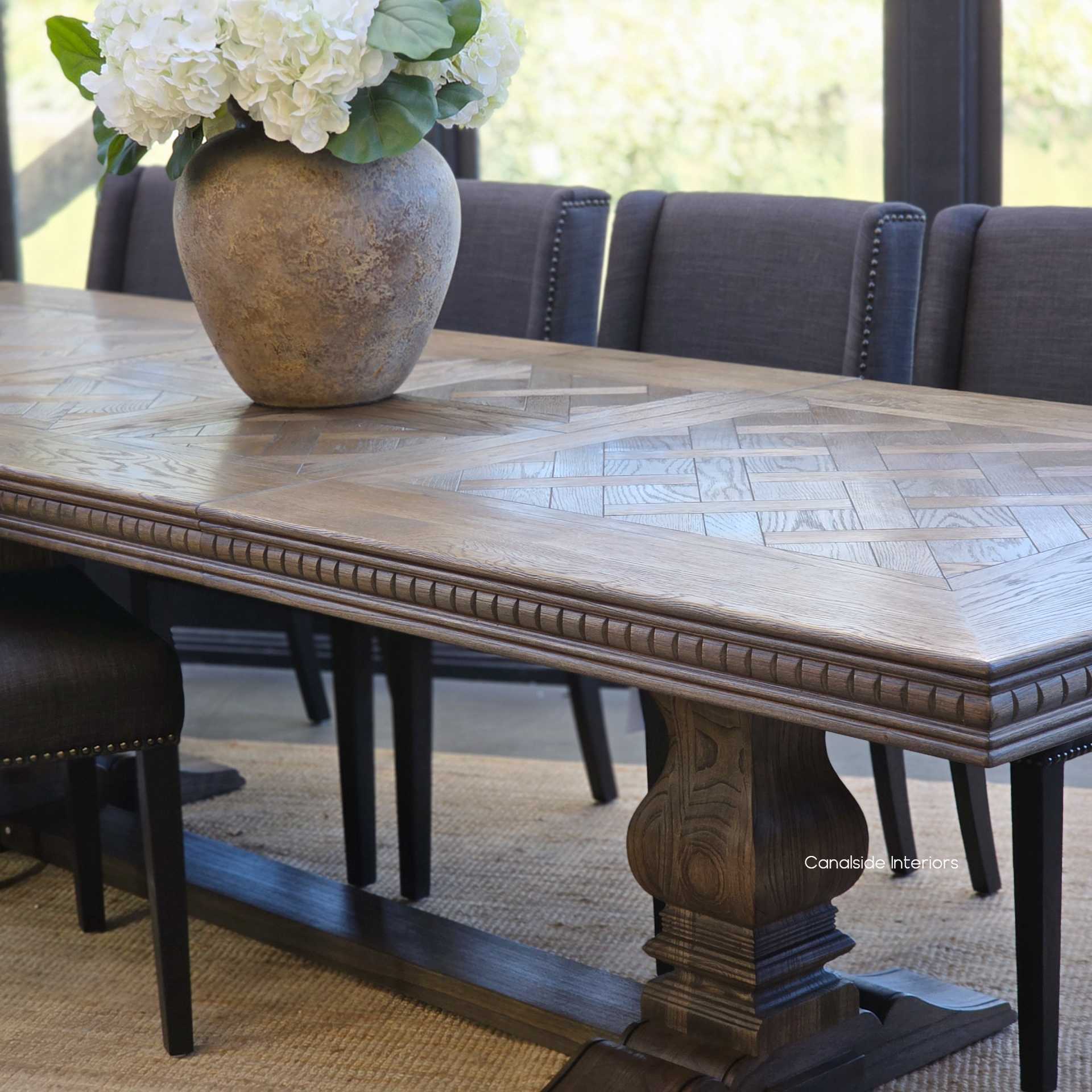 Cigar finish oak parquetry table top view with decorative centrepiece.
