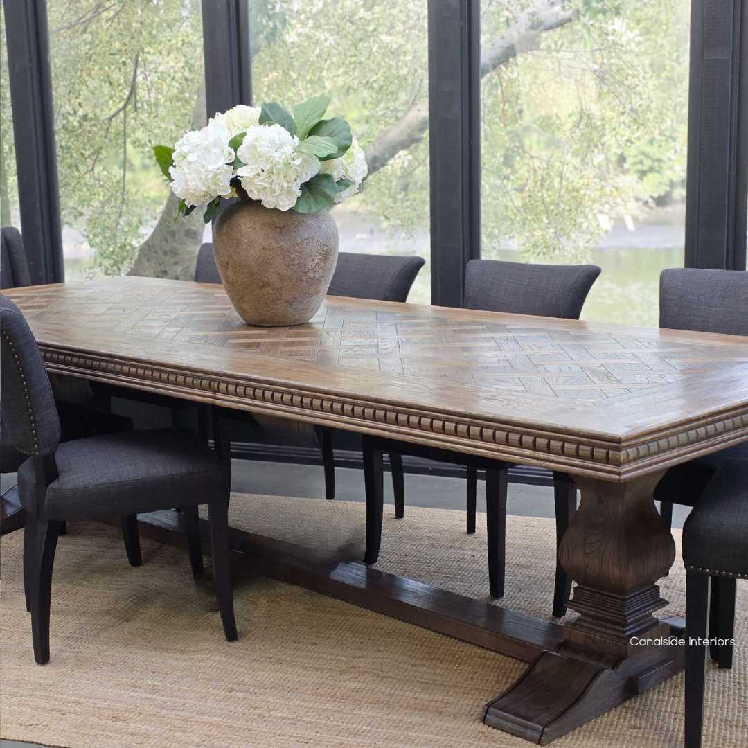 Berenson Oak Parquetry dining table in Cigar paired with classic upholstered seating.

