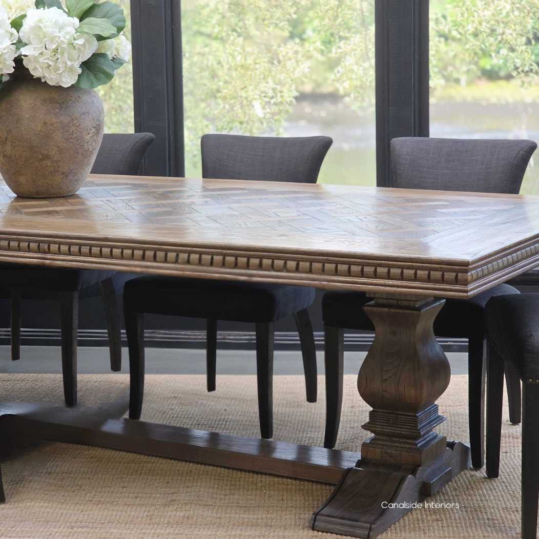 Berenson Cigar oak parquetry dining table in a modern Hamptons-inspired interior.
