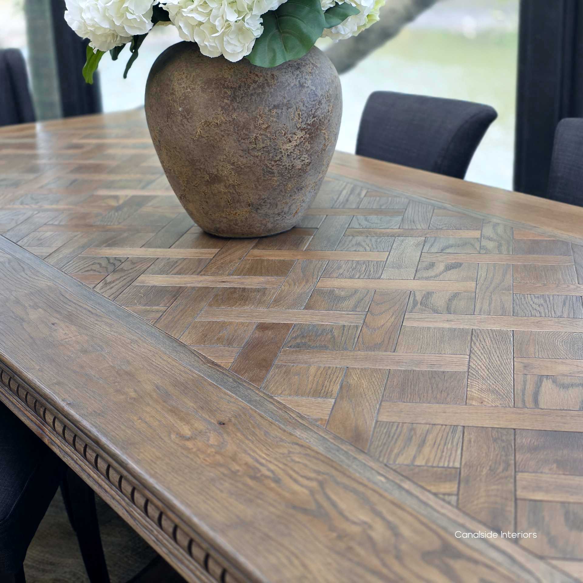Overhead view of the parquetry oak tabletop in rich Cigar finish.