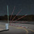LED-BRM-K15 Pegasus+ LED sensing edge installed on a DoorKing octagonal barrier arm at night
