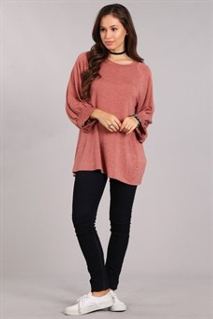 Rust knit, maternity tunic top in a loose fit with a round neck and bubble long sleeves.


Origin : USA
