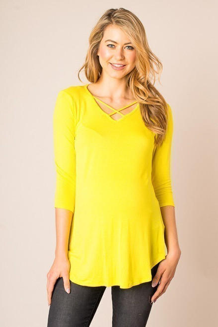 Solid yellow jersey knit long line maternity top with 3/4 sleeves, crossed strap detail in front, and rounded hem.


Origin : USA