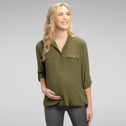 A button up maternity blouse made with sheer breathable fabric, featuring two pockets on the chest, light gold snap buttons and cuffed sleeves that can be worn long or rolled up and secured with matching light gold snap button strap.