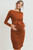 A rust long sleeve maternity dress featuring a front tie and side ruching. Wear this dress during pregnancy and afterward! Lift front tie detail for convenient access to chest for nursing or to pump!