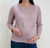 A lavender maternity long sleeve top featuring soft ribbed fabric, a round neckline, and a flattering gathered front design.