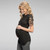 A solid hued maternity top featuring short crochet sleeves, a knotted hem and a rounded neckline.