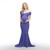 A solid hued maternity photoshoot or baby shower gown featuring an off shoulder elastic neckline with a wrap front style, mermaid style skirt with form-fitting ruched sides, cinching under the bust, and a hi-low hemline with a slight train.