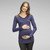 A solid hue maternity top featuring long sleeves and leopard mesh accent on top of shoulder and across the back.