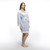 A striped hospital maternity robe featuring lace trim with an open front and a tie closure.