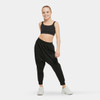 Girl wearing Studio 7 Dancewear Unisex Black Harem Pants, front view