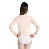 Woman wearing Capezio ballet knit wrap sweater top in pink, back view