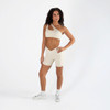 Energetiks Xenia Asymmetric Style Dance Crop Top Adult Sizes in Ivory Sands, dancer front view