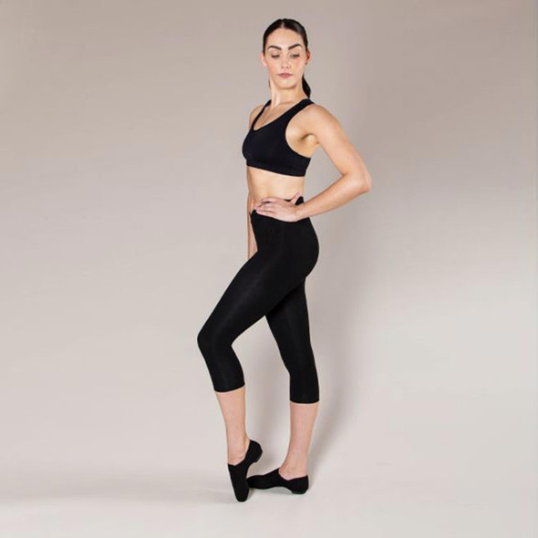Woman wearing Energetiks Tech Fit stretch canvas pull on jazz boot in Black, full body view