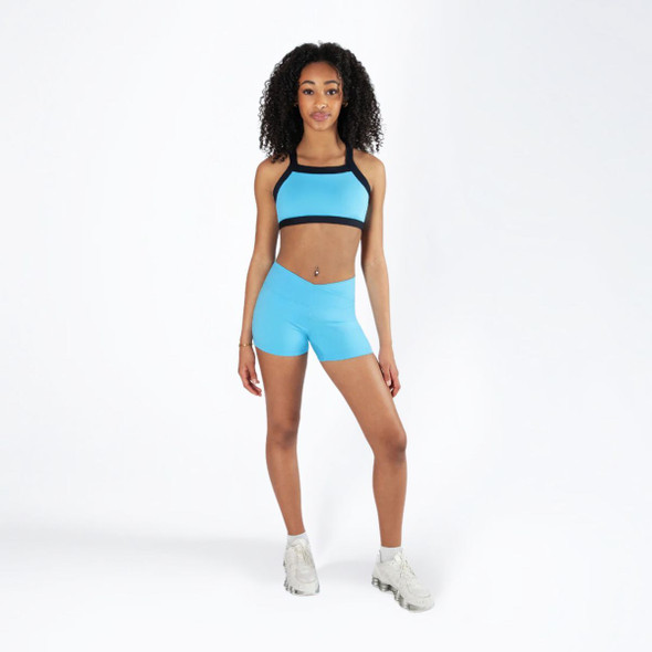 Energetiks Remi Twist-Back Dance Crop Top Children's Sizes in Sky Blue, dancer front view