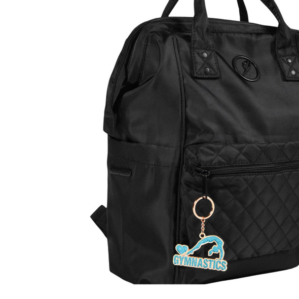 Energetiks Gymnastics Keyring hanging from a black dance bag