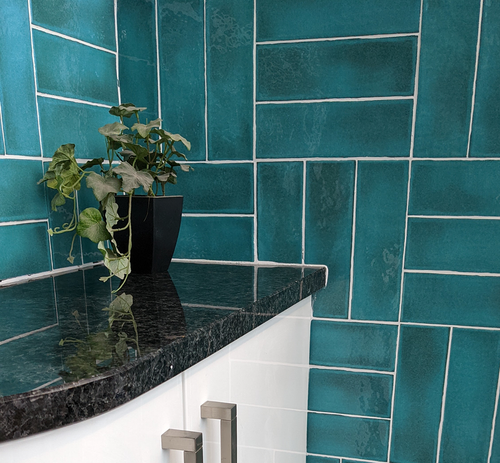 Siam Tiffany turquoise green blue gloss wall tiles laid in a basketweave pattern with white grout