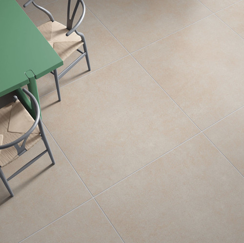Essential Urban Sand Cement Effect Tiles used in a kitchen dining area with a green table