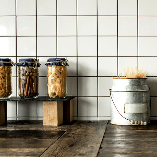 Johnsons Prismatics Square Satin Matt White Tiles used as a rustic kitchen splashback