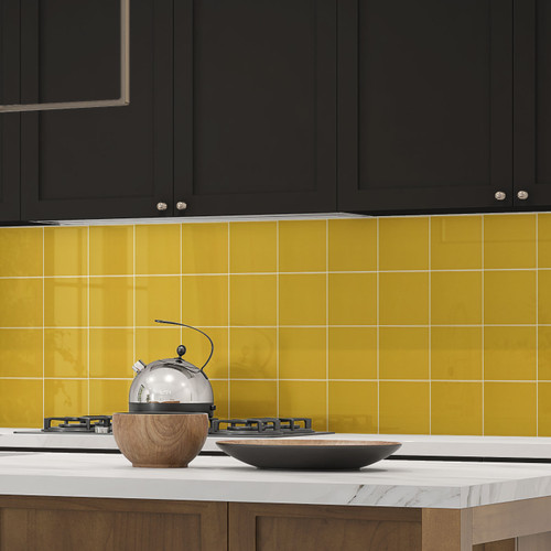 Johnsons Prismatics Square Gloss Sunflower Yellow Tiles used in a modern kitchen with black cupboards