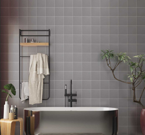 Johnsons Prismatics Square Matt Shark Grey Tiles used in a small bathroom with house plant