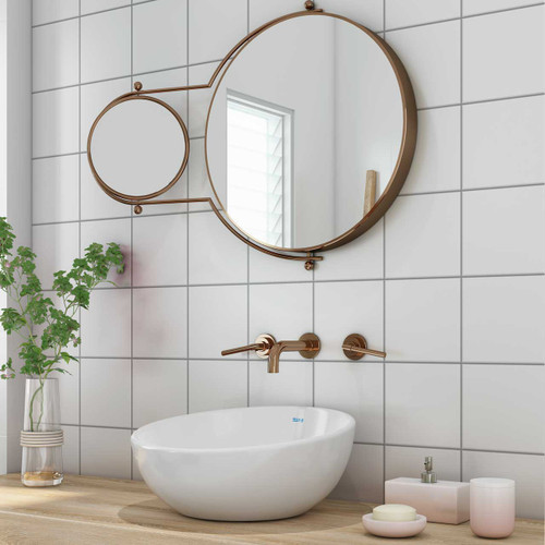 Johnsons Prismatics Square Matt White Tiles used in a small bathroom with a rose gold mirror