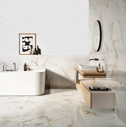 Calacatta marble effect tiles with gold veining used on walls and floors in a luxury bathroom