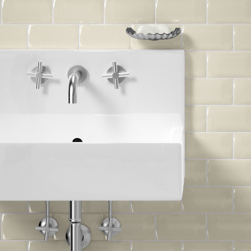 Bevel Brick Cream Metro Wall Tiles used as bathroom wall tiles with a white sink