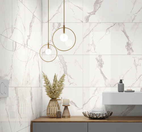 Polished white Grespania Marmorea Estatuario Marble Effect Tiles used in a small bathroom space