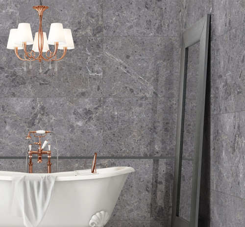 Grespania Artic Grey Polished Stone Effect Tiles used as stone effect wall tiles in a lavish bathroom with rose gold fittings