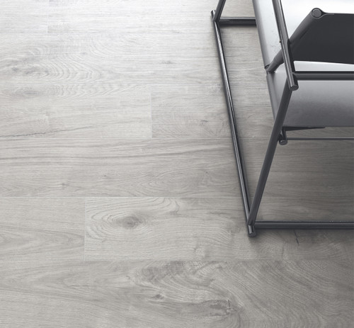 Valverdi Ardennes Grey Wood Effect Indoor Tiles used in a sitting room space with a chair