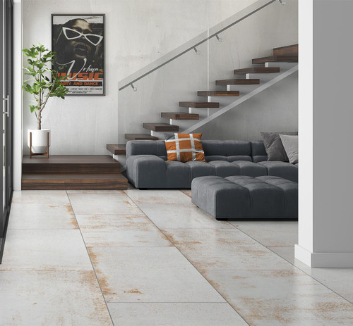 RAK Evoque Ice Matt polished metal effect white floor tiles used in a modern naturally lit sitting room