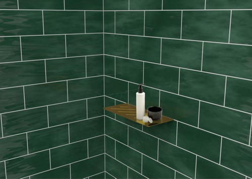 Genesis Stainless Steel Tile In Shower Shelf installed in a shower with green tiles