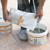 Mixing Schluter Kerdi-Coll Adhesive in the tub it comes in.