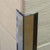 Genesis EAS Stainless Steel Corner Protector in copper protecting the corner of a wood covering