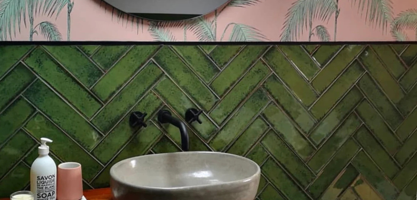 Vintage green metro tiles in a bathroom