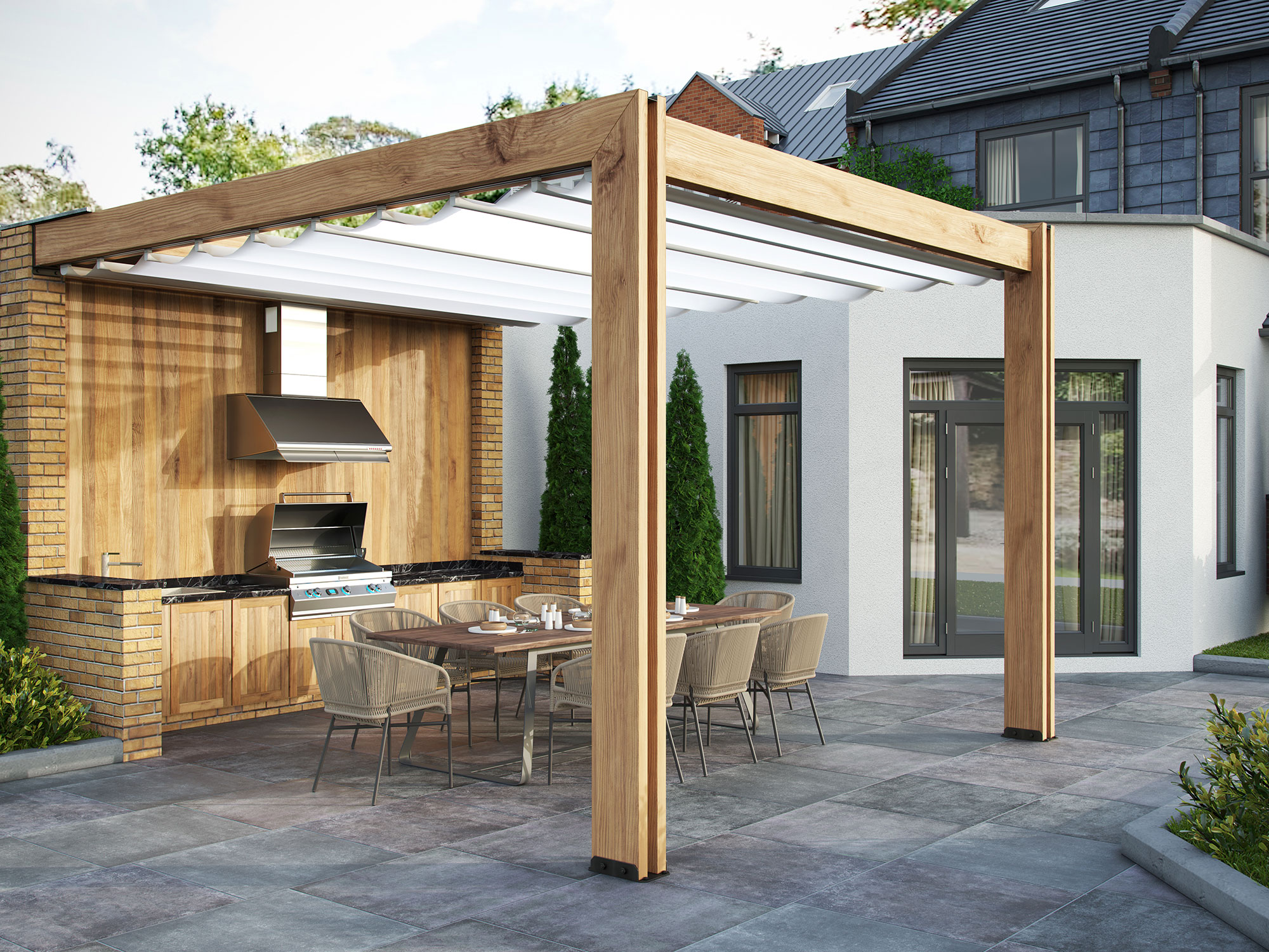 Grey cement effect porcelain tiles on a patio with wooden pergola and outdoor kitchen