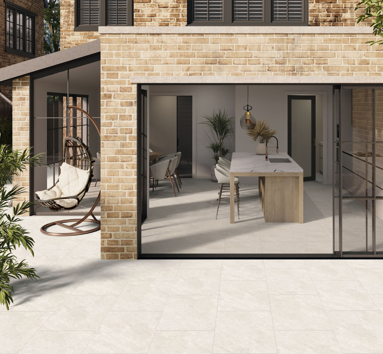 Warm white quartz effect porcelain paving tiles used on a patio with extension