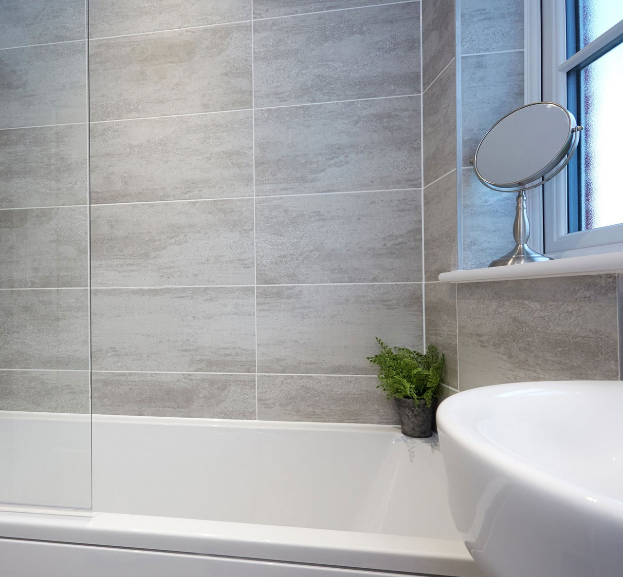 Johnsons Crafted Grey Stone Effect Wall Tiles used in a stone effect bathroom in a shower area