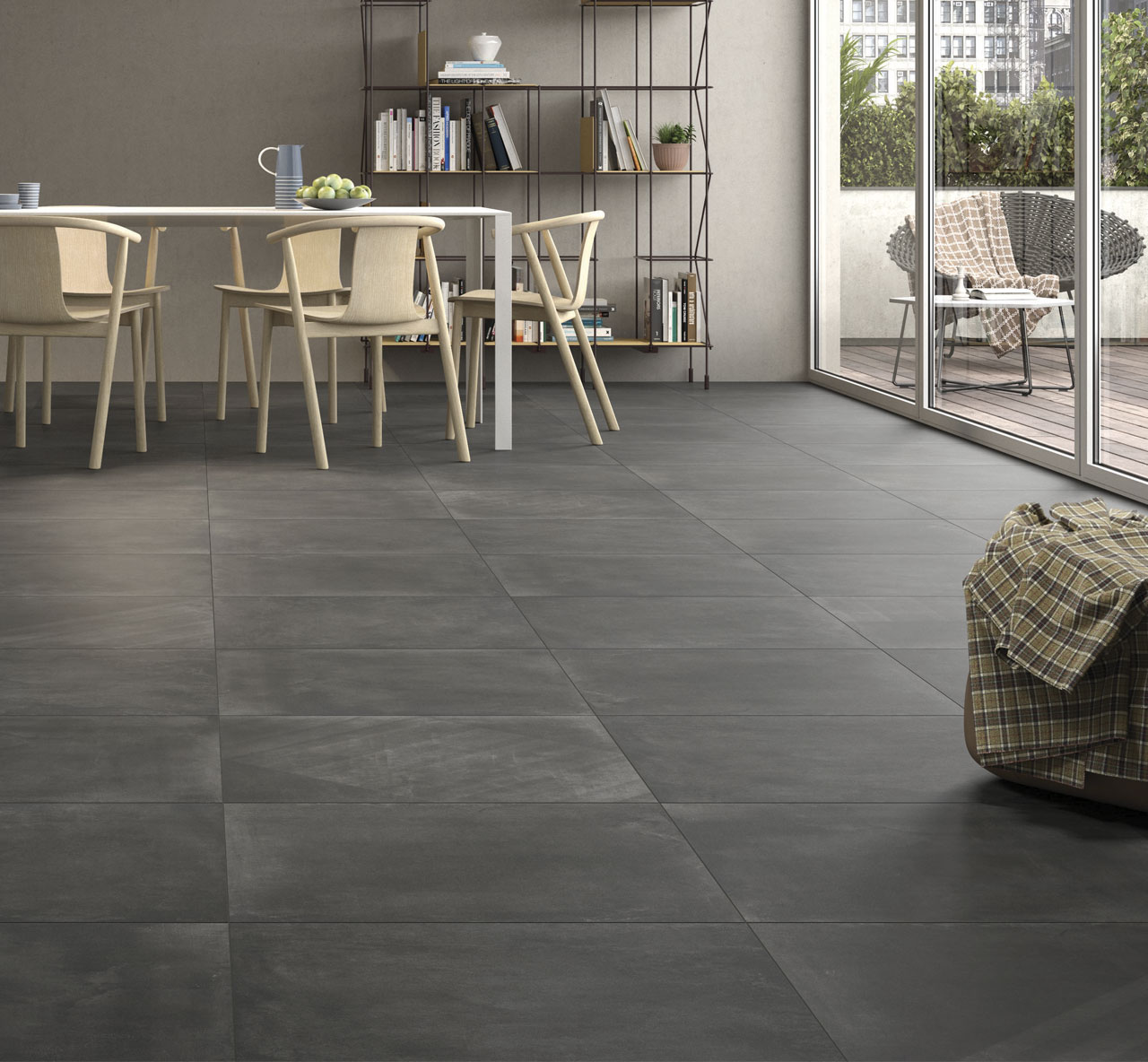 Basic Concrete Matt Dark Grey Concrete Effect Tiles used as floor tiles in a large open plan living space